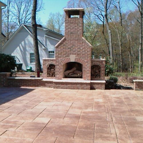 Outdoor patio with Fireplace in Raleigh by Total M