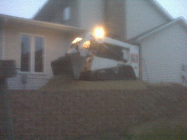 Adding some more gravel to this retaining wall we 