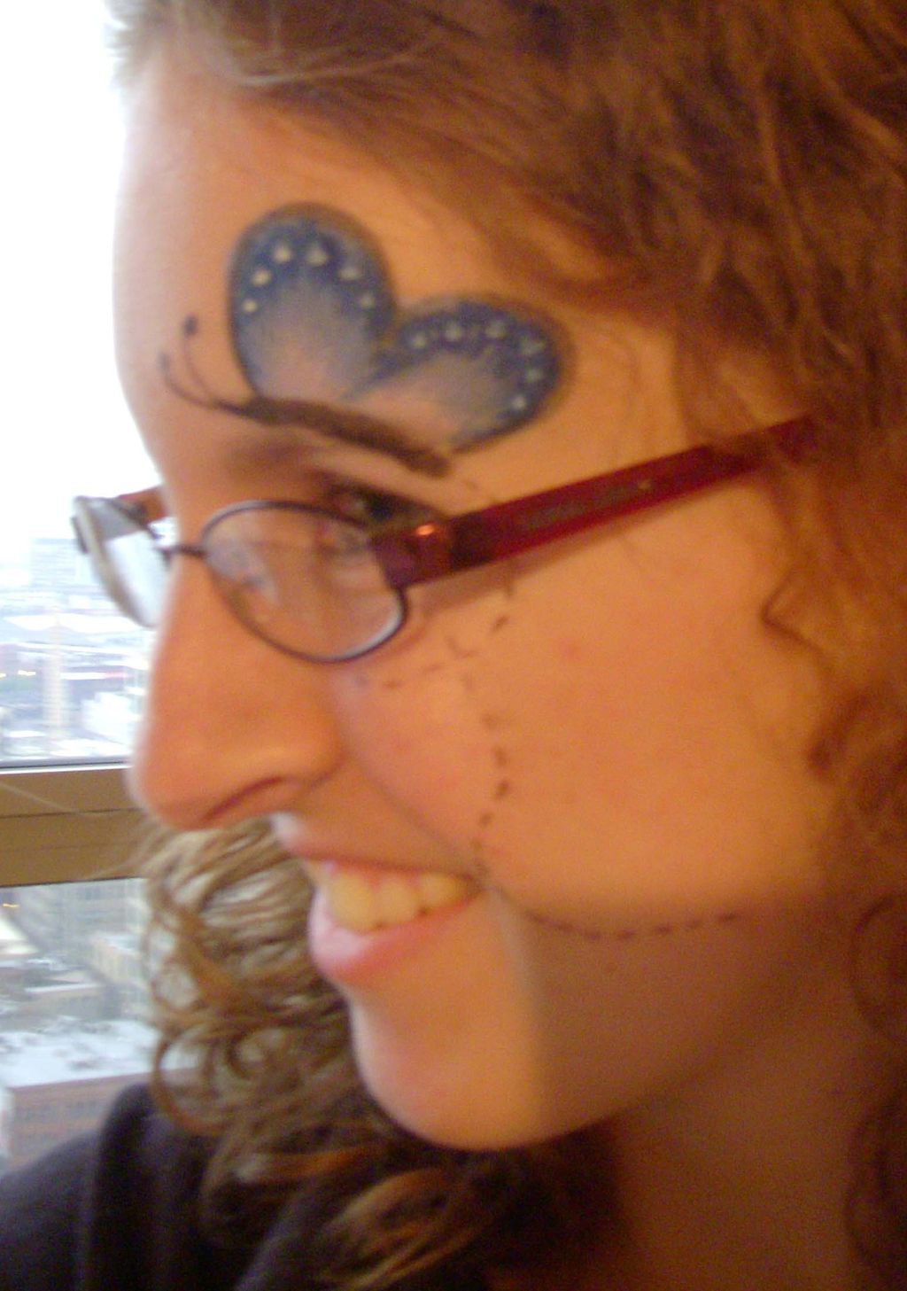 Butterfly flying across face