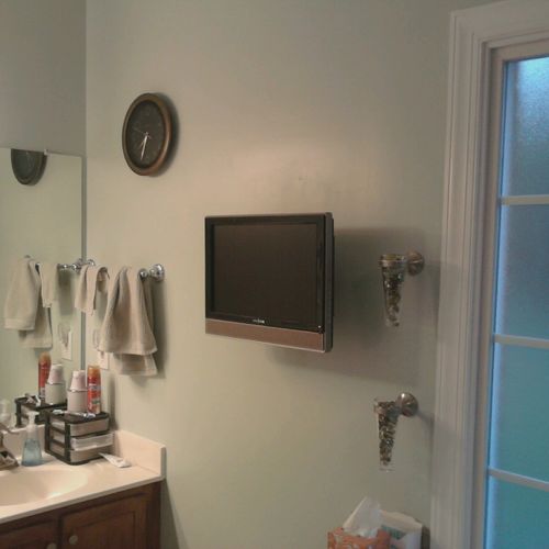 22" TV on articulating mount in bathroom.