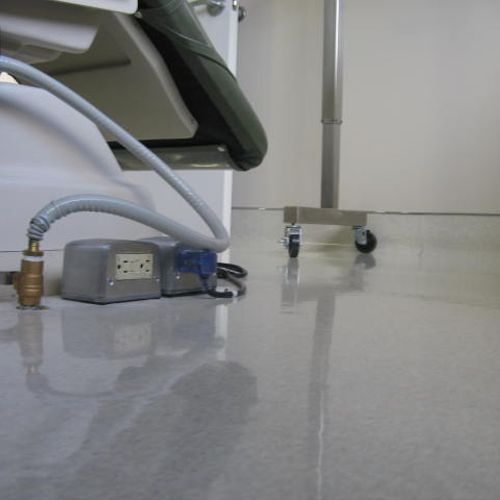 Electrical floor box for dental chair in exam room