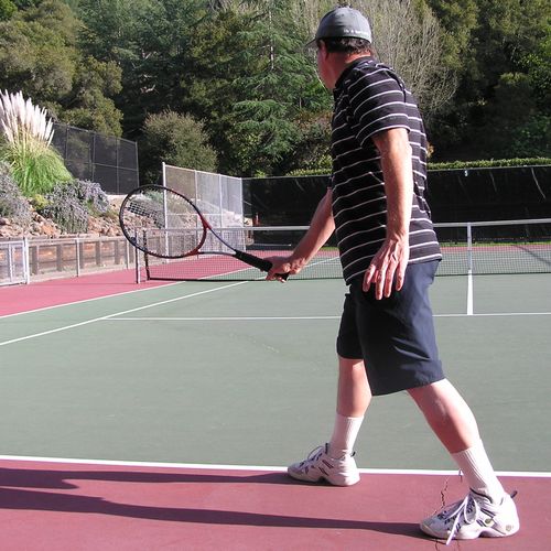 Racquet head also above hand at impact for a power