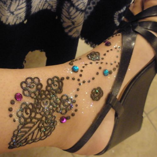 Henna on girls foot with gems and glitter by The N