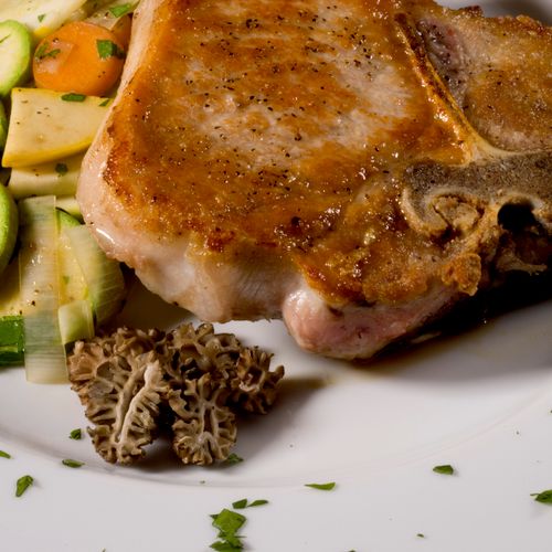 Seared Pork Chop  With Morels And Seasonal Veg