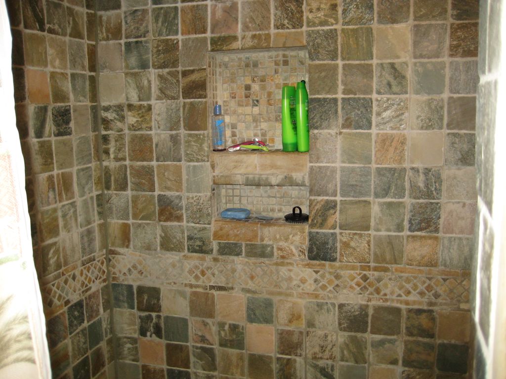 Walk in quarry w/ glass block wall shower