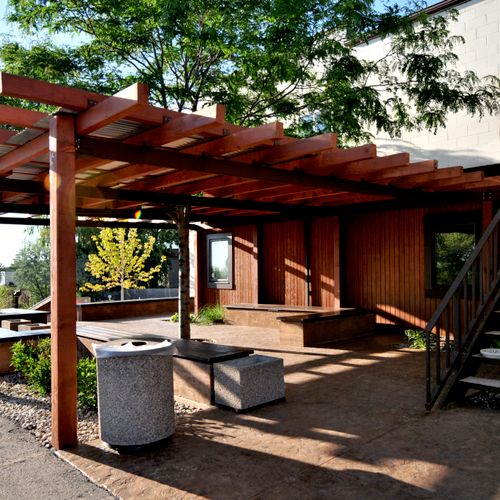 Pergola with tree growing through on a patio