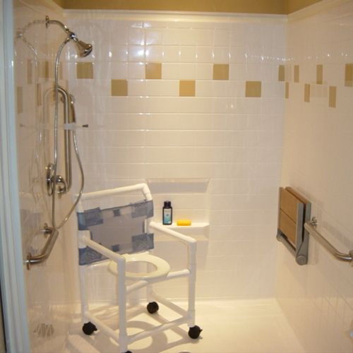 Barrier free shower with fold down seat