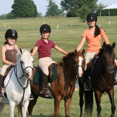 Girls riding horseback at DeVaux Farms