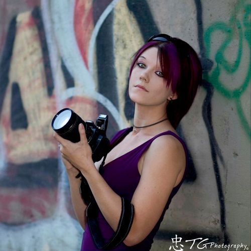 Photographer with purple hair, yeah were hip at 50