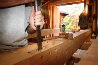 Cutting a mortise joint in a timber