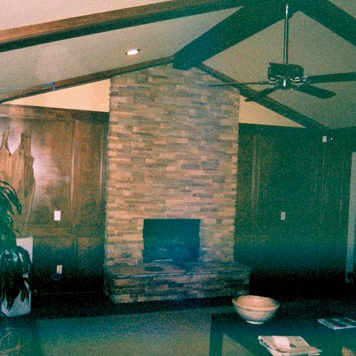 Indoor fireplace remodel using manufactured stone 