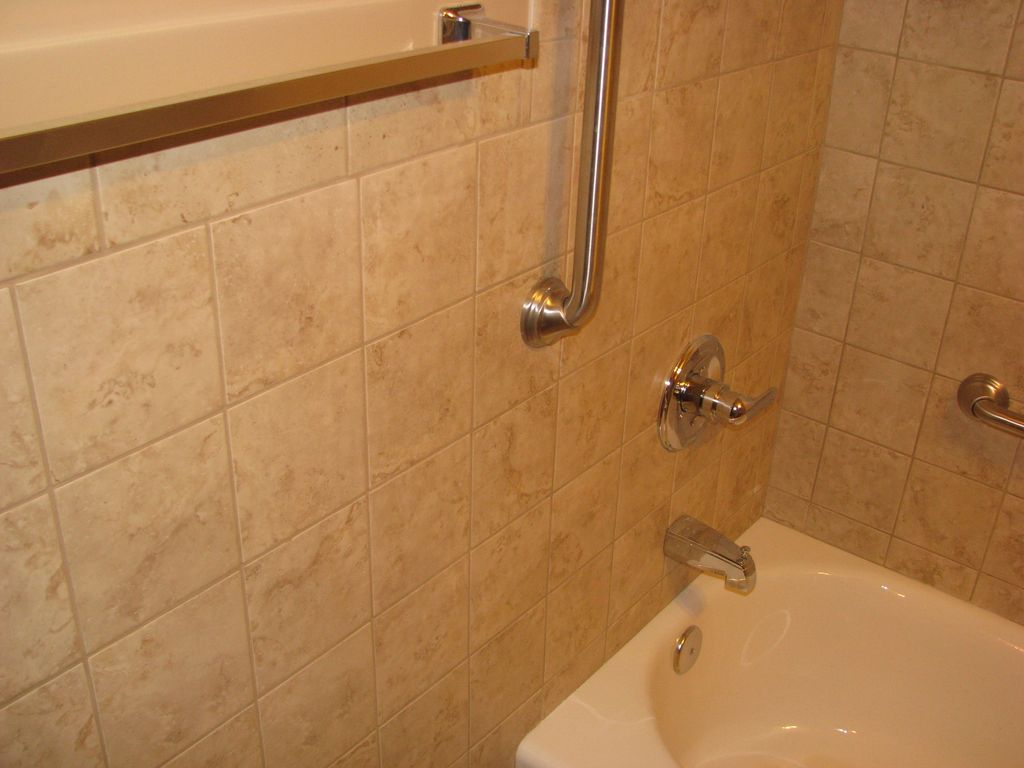 Donahue bath - wall tile, grab rails