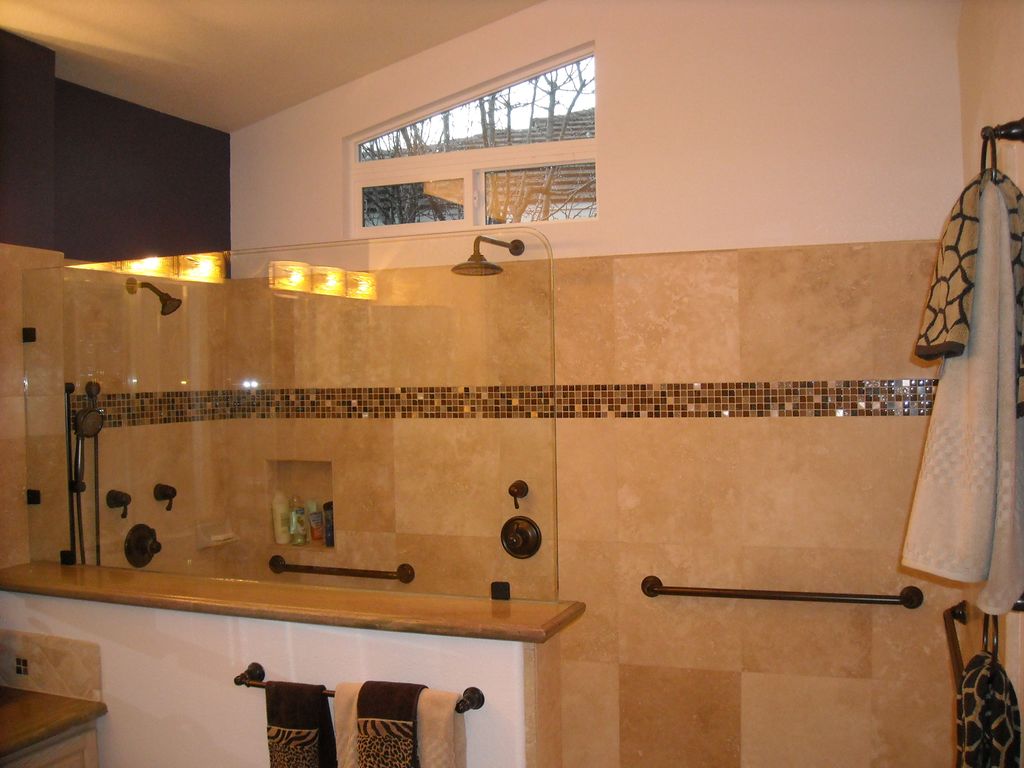 Custom designed walk-in shower with Travertine sto