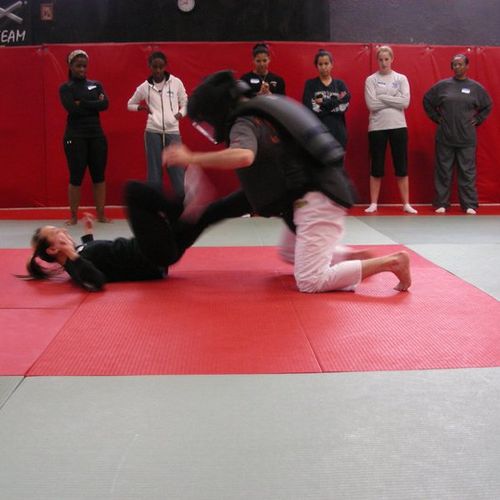 Sharon, the head instructor, kicking the attacker 