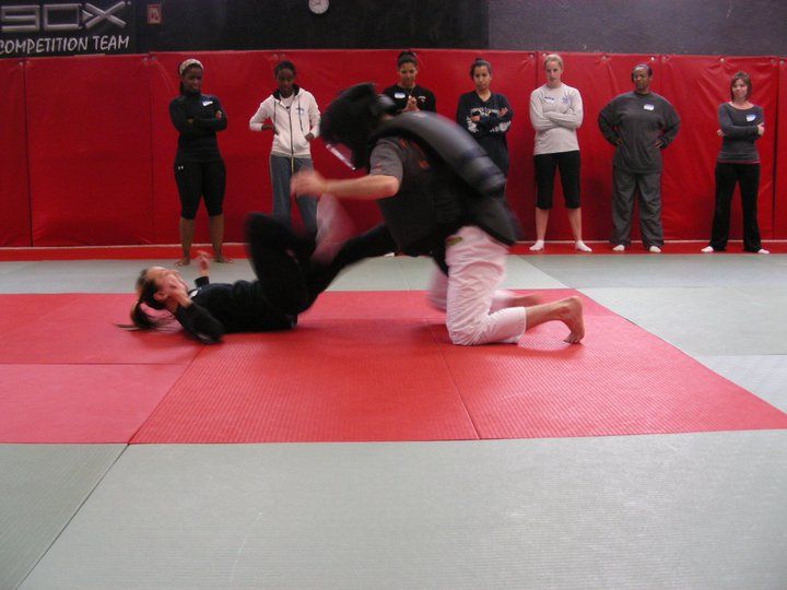 Sharon, the head instructor, kicking the attacker 