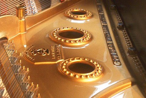 The re-gilded gold harp of a 1924 Steinway semi-co