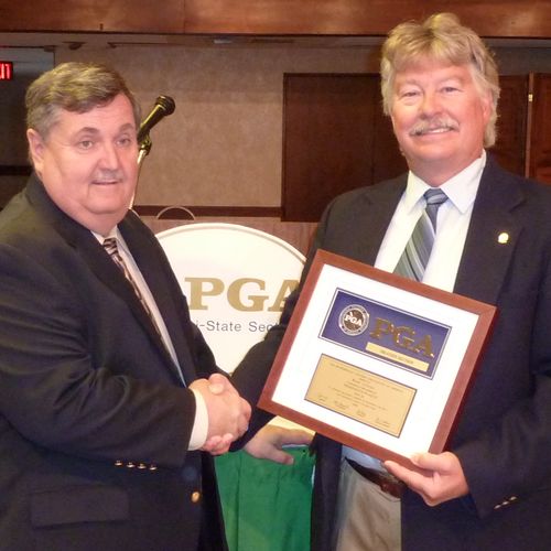 Ron receiving the President's Plaque Award