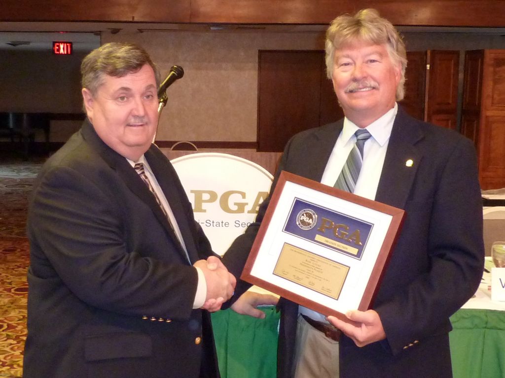 Ron receiving the President's Plaque Award