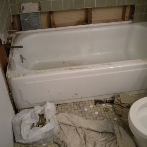 The tile surround was falling off and the tub had 