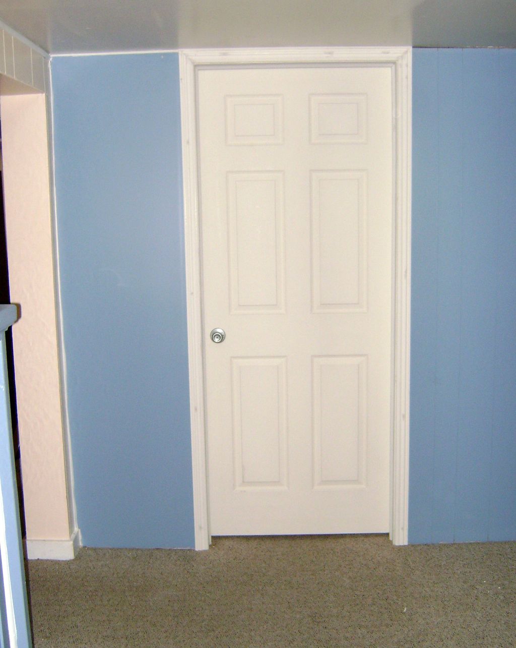 Raise height of door frame, replace door, repaint 