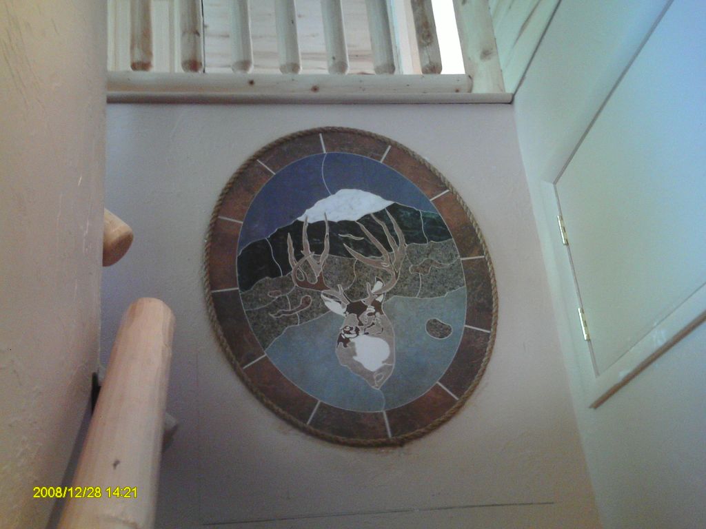 Water-jet cut tile and stone medallion composed of