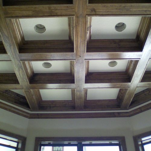 This is a dropdown ceiling with crown mold and inl