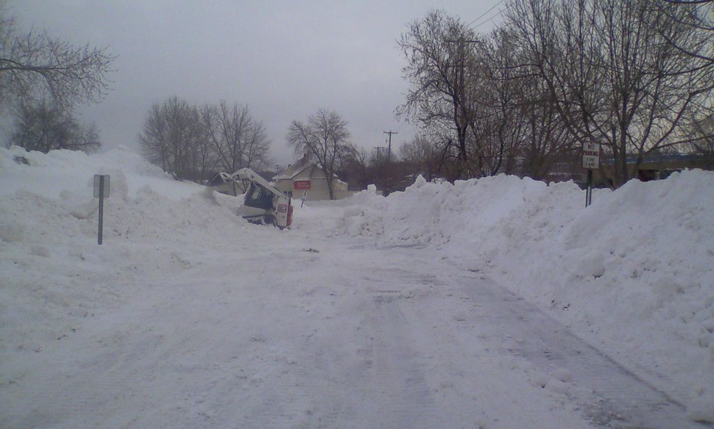 Pushing some snow piles back at one of our lots. L