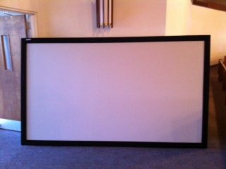 Fixed projector screen to be used in Houston House