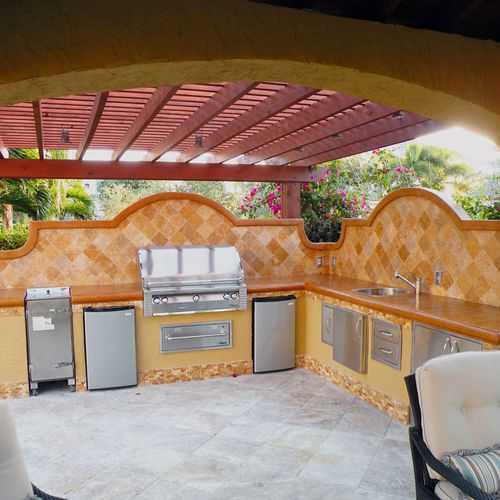 An outdoor Kitchen makes a great addition to swimm