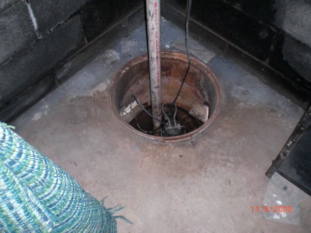 Open sump pit. A drain also terminates here. Reall