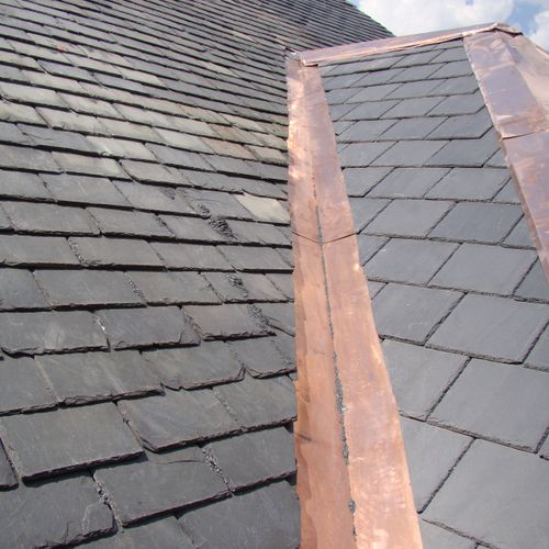 Specialist in slate roof repair and installation.