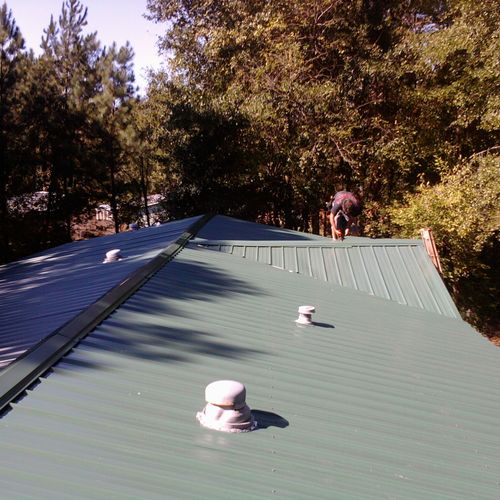 Metal roof installed over shingles on double wide 