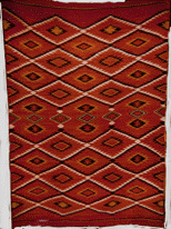 Navajo textile with cochineal raveled yarn and han