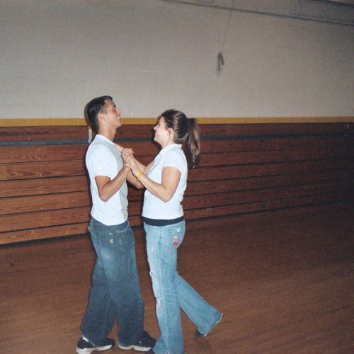 Student couple practicing one of many dance figure