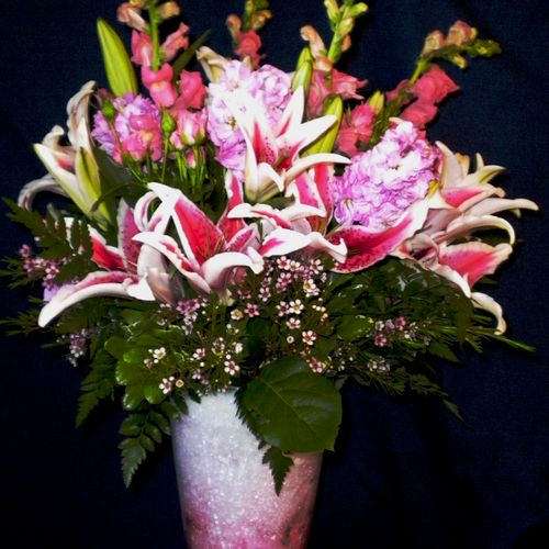 Pink snapdragon and starfighter lily bouquet