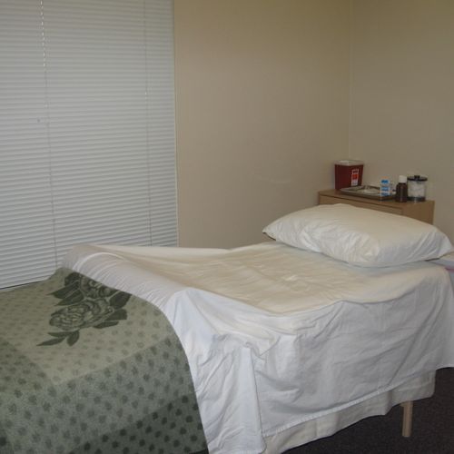 Private and relaxing treatment room with heated ta