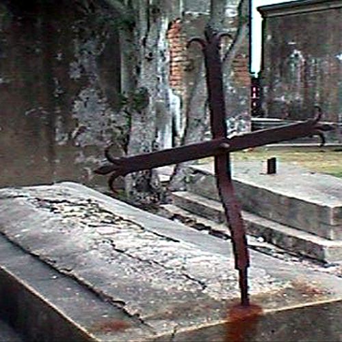 Rusted Iron Cross in Louisiana Cemetery