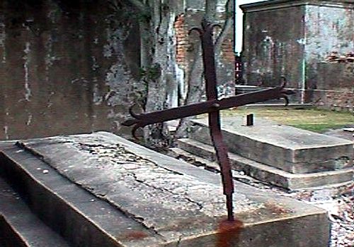 Rusted Iron Cross in Louisiana Cemetery
