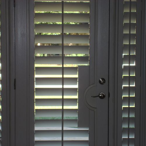 Polycore plantation shutters on front door and sid