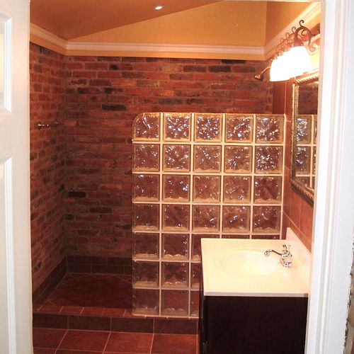 Bathroom built out of mud room. Walk in brick show