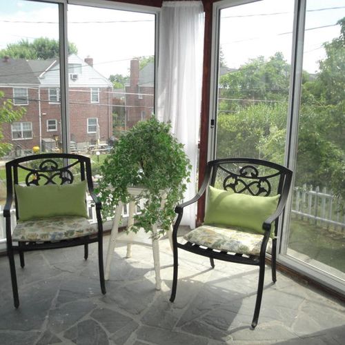 I staged this sun porch with gauzy curtains and a 