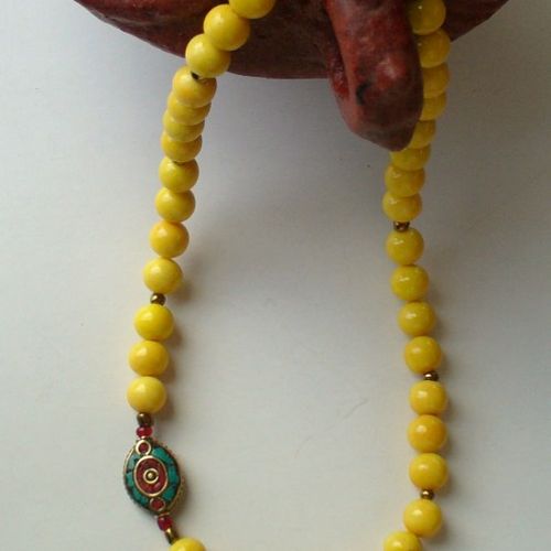 yellow limestone with a tibetan side bead