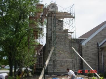 Rebuilding stone chimney for a church