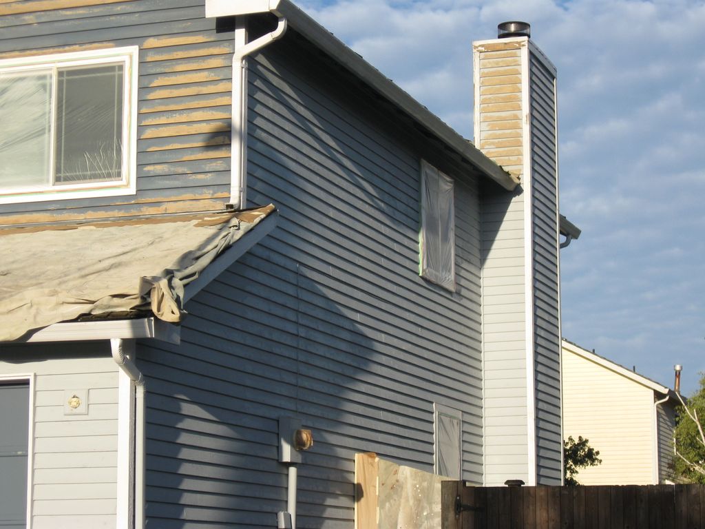 Taping of windows and roofs and sanding of siding