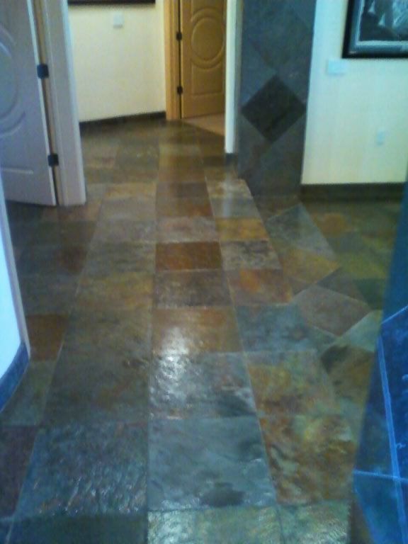 Slate tile, cleaned and coated.