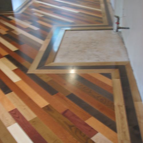 a custom multi color multi wood floor with borders