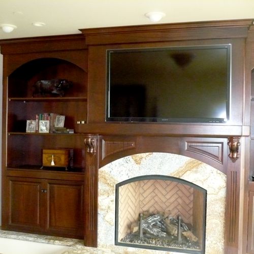 Mahogany Cabs that surround Fireplace