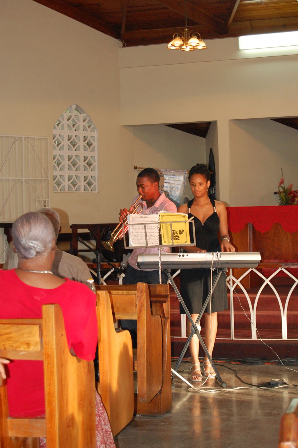 Playing a jazz number on the keyboard with a trump