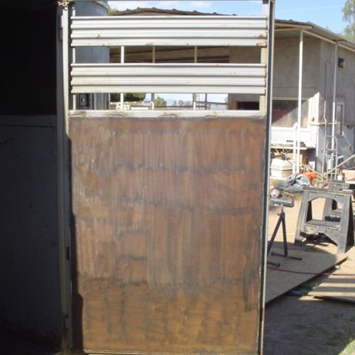 New steel panel on side door of horse trailer.