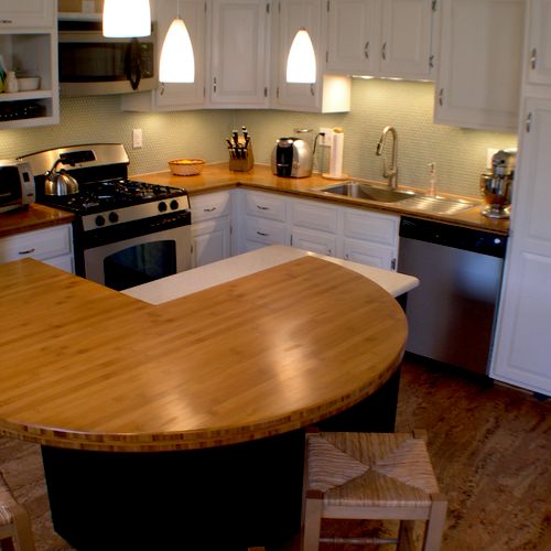 Remodeled kitchen with penny tile backsplash, cork